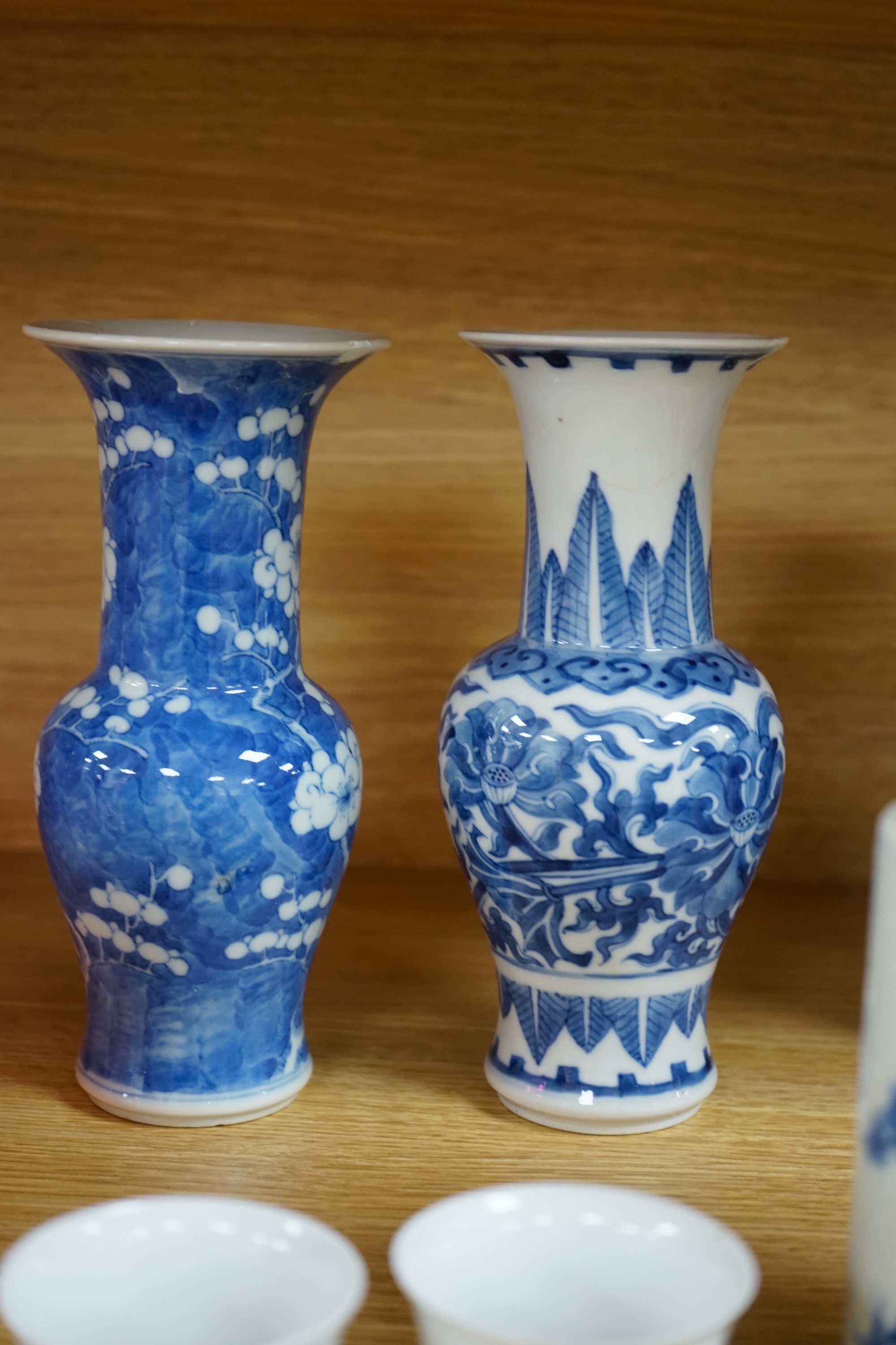 A collection of 19th and 20th century Chinese blue and white vases and tea bowls, largest 21cm high. Condition - varies, mostly poor